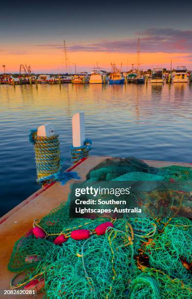 dawn light on a late summer's morning at the lakes entrance harbour, victoria, australia. - lakes entrance stock pictures, royalty-free photos & images