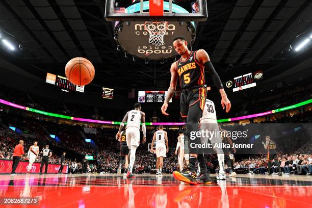 Dejounte Murray of the Atlanta Hawks looks on during the second quarter of the game against the Portland Trail Blazers at the Moda Center on March...