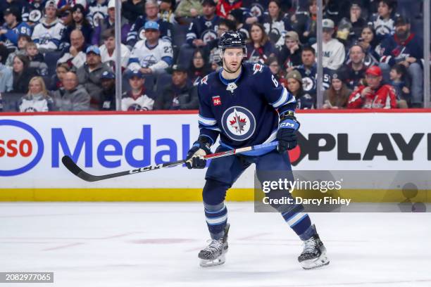 Colin Miller of the Winnipeg Jets keeps an eye on the play during third period action against the Washington Capitals at the Canada Life Centre on...