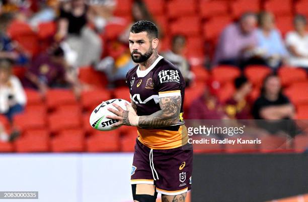 Adam Reynolds of the Broncos looks to pass during the warm up before the round two NRL match between the Brisbane Broncos and South Sydney Rabbitohs...