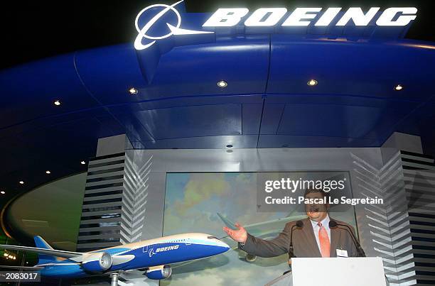 Robert Pollack, vice president of branding at Boeing Commercial Airplanes Marketing, announces the name of its newest plane, the Boeing 7E7, at the...