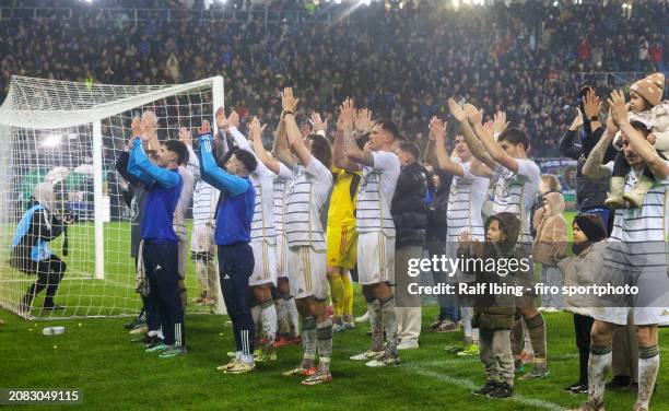 Players of 1. FC Saarbrücken celebrate the victory after the DFB cup quarterfinal match between 1. FC Saarbrücken and Borussia Mönchengladbach at...