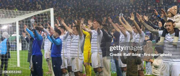 Players of 1. FC Saarbrücken celebrate the victory after the DFB cup quarterfinal match between 1. FC Saarbrücken and Borussia Mönchengladbach at...