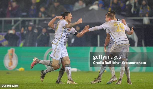 Marcel Gaus of 1. FC Saarbrücken and teammates celebrate the victory after the DFB cup quarterfinal match between 1. FC Saarbrücken and Borussia...