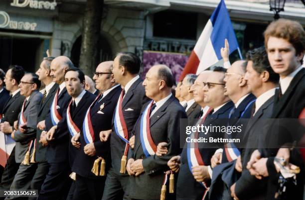 Members of the Chamber of Deputies, wearing their sashes, join a demonstration in support of General De Gaulle on the Champs-Élysées in Paris, May...