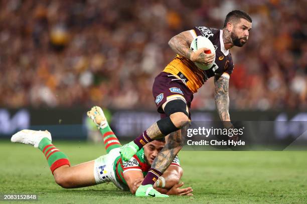 Adam Reynolds of the Broncos makes a break during the round two NRL match between Brisbane Broncos and South Sydney Rabbitohs at Suncorp Stadium, on...