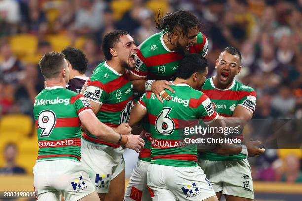 Siliva Havili of the Rabbitohs celebrates a try with team mates during the round two NRL match between Brisbane Broncos and South Sydney Rabbitohs at...