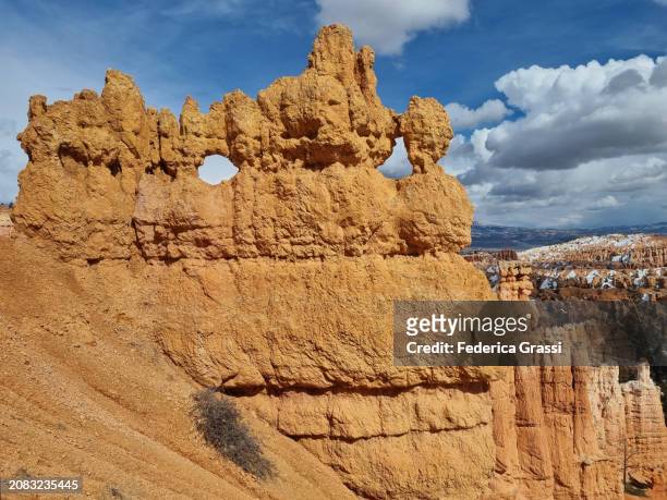 window created by erosion in a sandstone wall at bryce canyon national park - pinnacle rock stock pictures, royalty-free photos & images