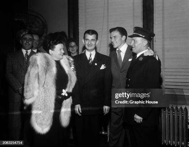 American singer and actor Frank Sinatra is presented with the Key to the City as part of celebrations of 'Frank Sinatra Day' with mayor Fred DeSapio...