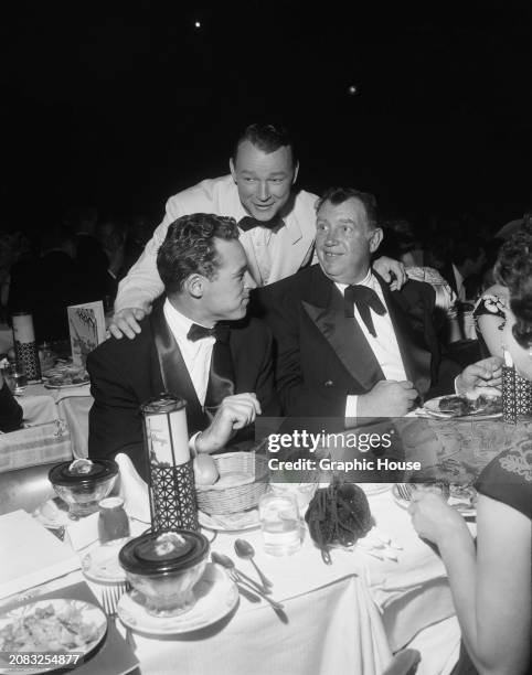 American actors Guy Madison , Roy Rogers , Andy Devine at Emmy Awards ceremony, US, circa 1950.