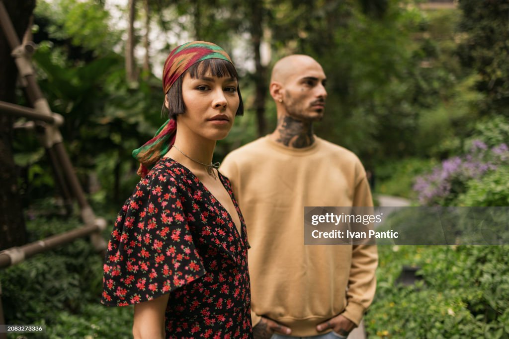 Portrait of Asian woman in front of her boyfriend in nature.