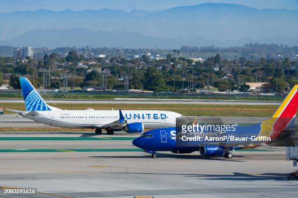 United Airlines Boeing 737-9 MAX and Southwest Airlines Boeing 737-76N prepare for takeoff at Los Angeles International Airport on March 16, 2024 in...