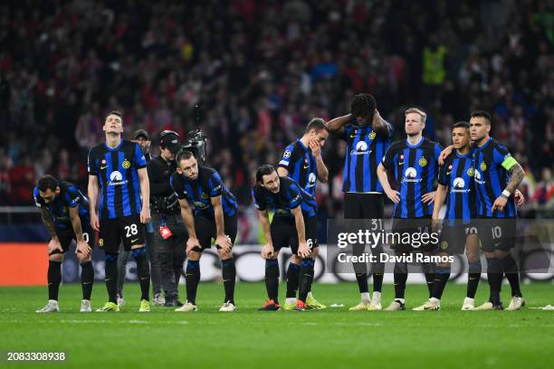 Players of FC Internazionale look dejected in the penalty shoot out during the UEFA Champions League 2023/24 round of 16 second leg match between...