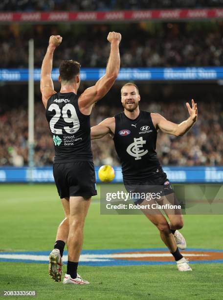 Harry McKay of the Blues and George Hewett of the Blues celebrate after the Blues defeated the Tigers during the round one AFL match between Carlton...