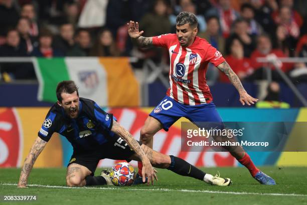 Axel Witsel of Atletico Madrid clashes with Francesco Acerbi of FC Internazionale during the UEFA Champions League 2023/24 round of 16 second leg...