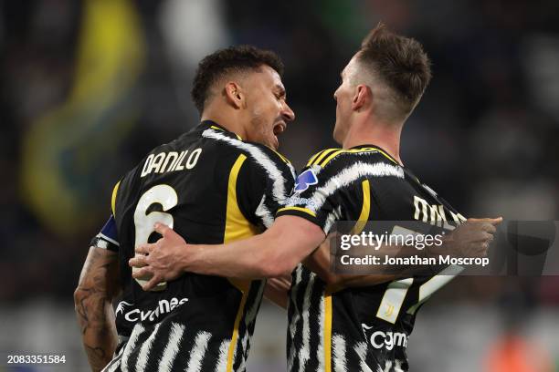 Arkadiusz Milik of Juventus is embraced by team mate Danilo after scoring to give the side a 2-1 lead during the Serie A TIM match between Juventus...