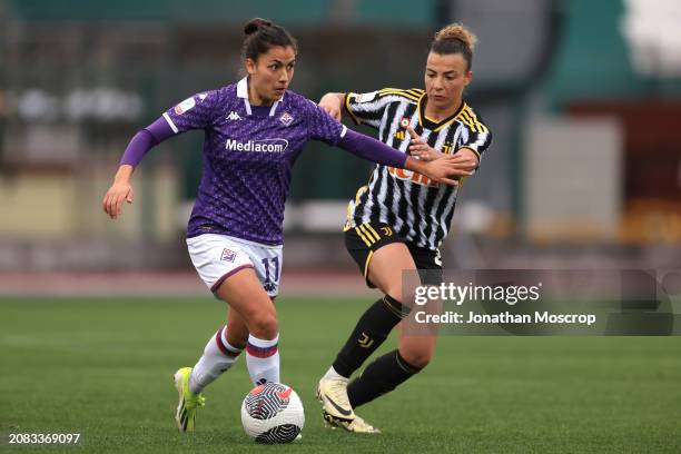 Melissa Bellucci of ACF Fiorentina holds off a challenge from Arianna Caruso of Juventus during the Women's Coppa Italia semi final 2nd leg match...