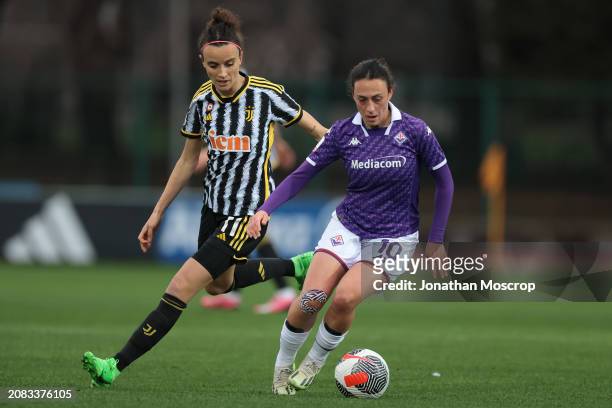 Michela Catena of ACF Fiorentina is pursued by Barbara Bonansea of Juventus during the Women's Coppa Italia semi final 2nd leg match between Juventus...