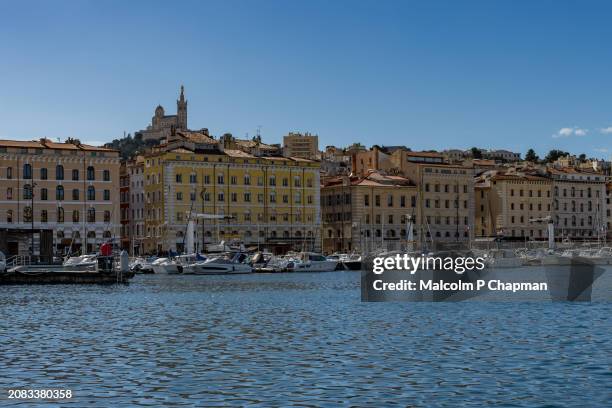 vieux port and view towards notre dame de la garde, marseille - vieux stock pictures, royalty-free photos & images