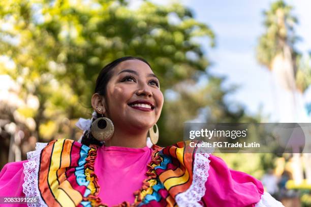 young woman contemplating outdoors - latin music stock pictures, royalty-free photos & images