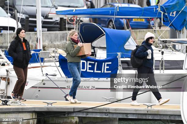 Eve Hewson , Eva Birthistle, Sarah Greene walk to the yacht as they film scenes for the Apple TV show 'Bad Sisters' at Weymouth Harbour on March 14,...