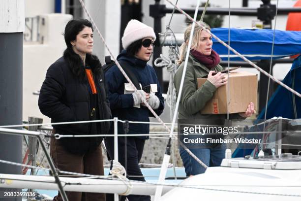 Eve Hewson , Eva Birthistle, Sarah Greene walk to the yacht as they film scenes for the Apple TV show 'Bad Sisters' at Weymouth Harbour on March 14,...