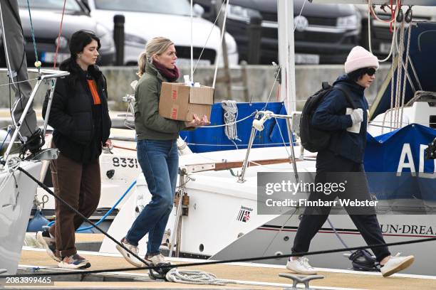 Eve Hewson , Eva Birthistle, Sarah Greene walk to the yacht as they film scenes for the Apple TV show 'Bad Sisters' at Weymouth Harbour on March 14,...