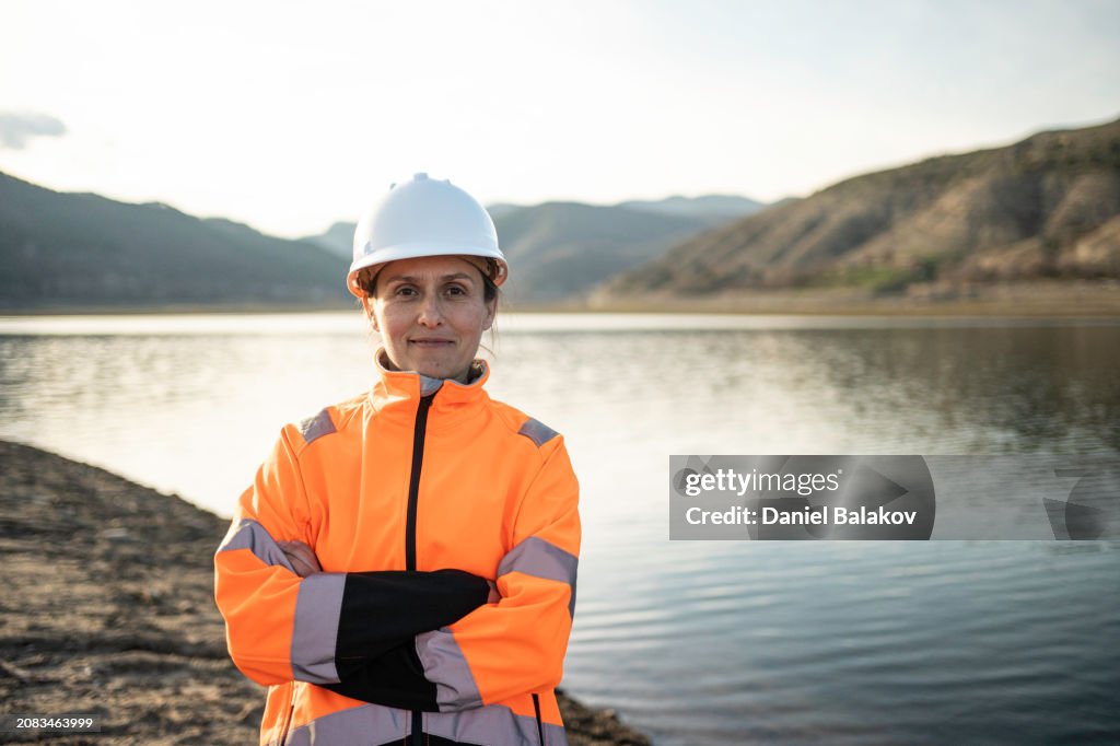 Portrait of Smiling Female Hydroelectric Engineer.