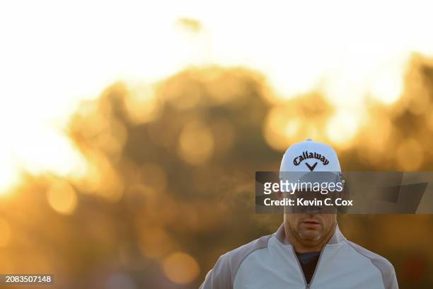Alex Noren of Sweden walks across the practice green during the first round of THE PLAYERS Championship on the Stadium Course at TPC Sawgrass on...