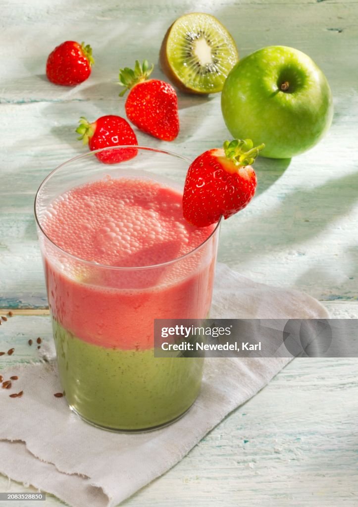 A two layer strawberry and apple smoothie with almond milk