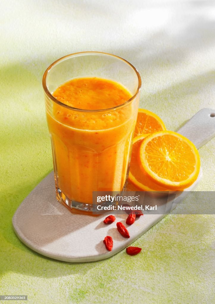 A sunshine smoothie made with bananas, pineapple, mango, oranges and goji berries