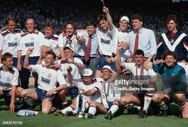 The Bolton Wanderers squad including Phil Neal and Phil Brown celebrate after victory in the 1989 Sherpa Van trophy Final against Torquay United at...