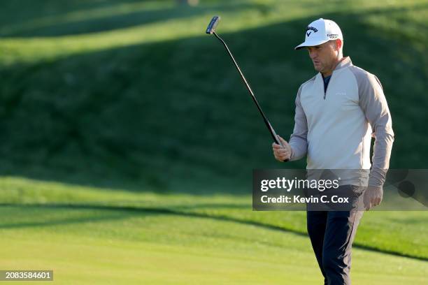 Alex Noren of Sweden lines up a putt on the second green during the first round of THE PLAYERS Championship on the Stadium Course at TPC Sawgrass on...