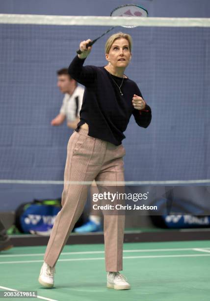 Sophie, Duchess of Edinburgh takes part in a badminton match as she attends the All England Open Badminton Championships with Prince Edward, Duke of...