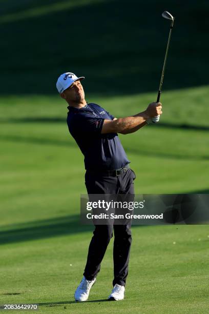 Alex Noren of Sweden plays a shot on the fourth hole during the first round of THE PLAYERS Championship on the Stadium Course at TPC Sawgrass on...