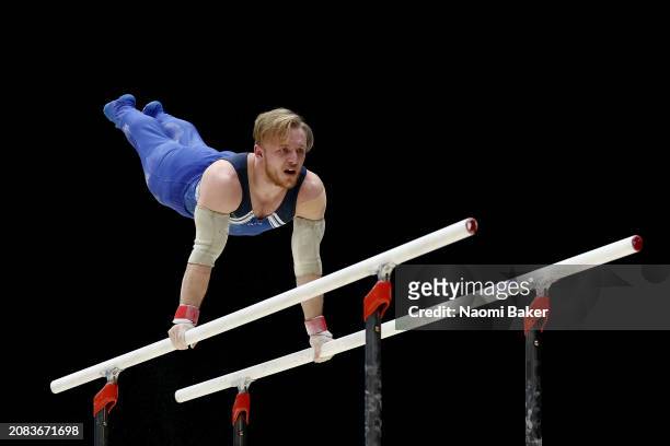 Blake Gidley of Lincoln Gymnastics Club competes on the parallel bars in the Men's Disability Masters during Day One of the 2024 Gymnastics British...