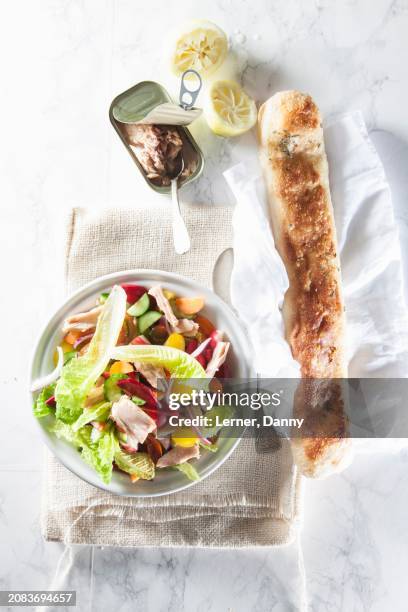 a mixed salad with tuna fish and baguette (seen from above) - tuna baguette stock pictures, royalty-free photos & images