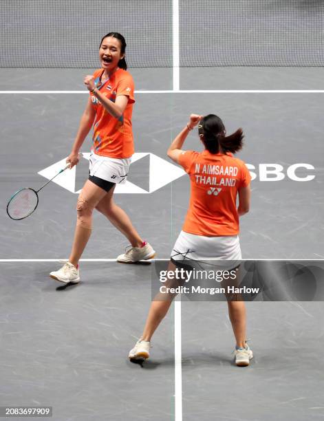 Benyapa Aimsaard and Nuntakarn Aimsaard of Thailand react against Liu Shengshu and Tan Ning of China in the Women's Doubles on Day Three of the Yonex...