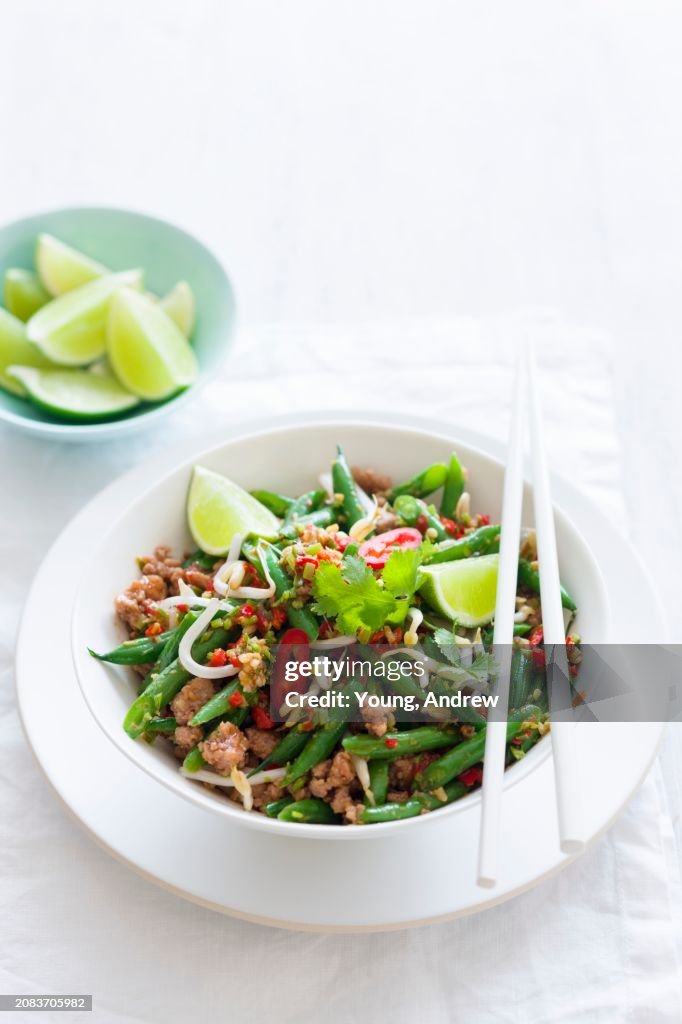 Fried beans with minced meat and limes (Asia)
