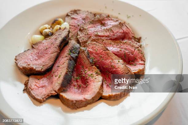 roast medium rare filet mignon tenderloin - high key stock pictures, royalty-free photos & images