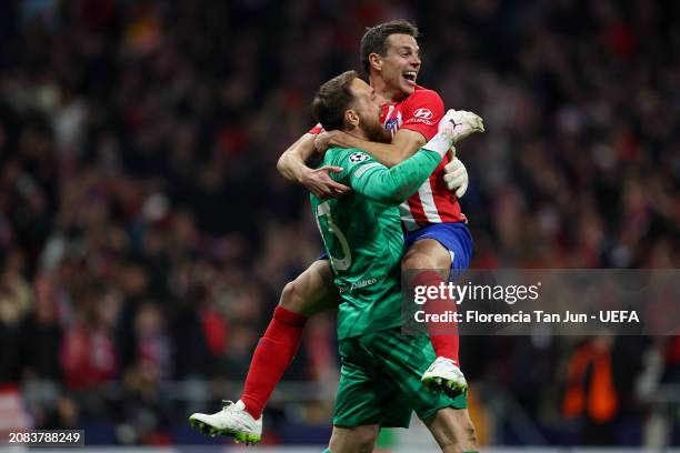 Jan Oblak of Atletico de Madrid celebrates with teammate Cesar Azpilicueta the team's victory in the penalty shoot out after the UEFA Champions...