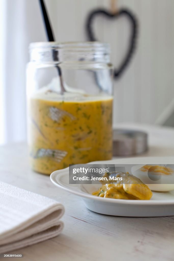 Mustard with harring and boiled egg