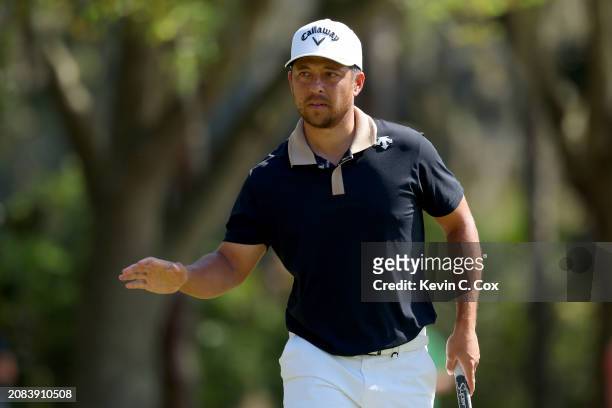 Xander Schauffele of the United States reacts after a birdie on the third green during the first round of THE PLAYERS Championship on the Stadium...