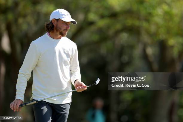 Tommy Fleetwood of England prepares to putt on the third green during the first round of THE PLAYERS Championship on the Stadium Course at TPC...