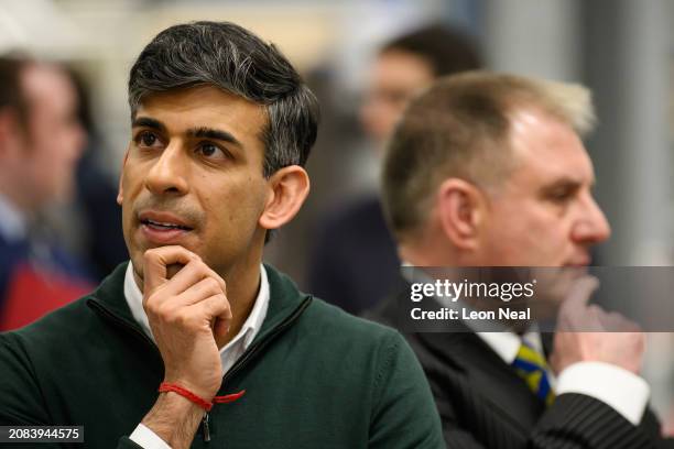 Prime Minister Rishi Sunak and Conservative MP for Filton and Bradley Stoke Jack Lopresti listen to information on engine development during a visit...