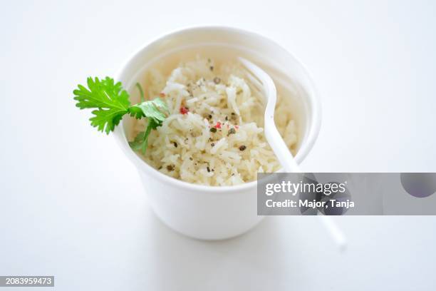 Rice With Pepper And Parsley In A Takeaway Pot, ストックフォト