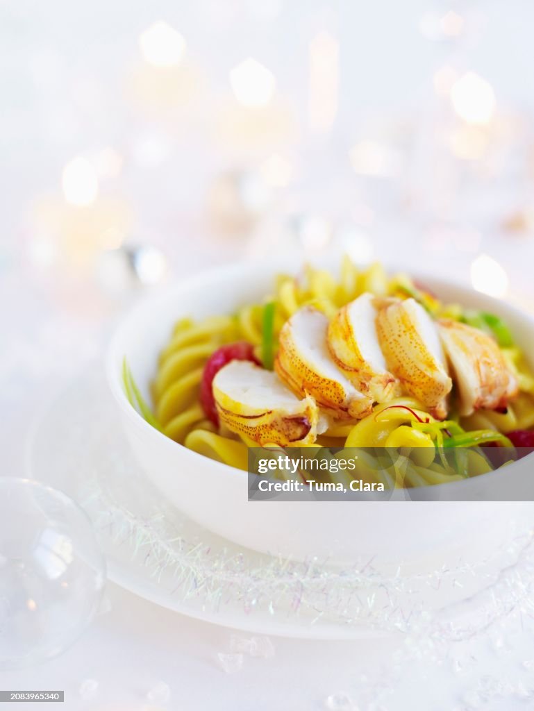 Crab tails in saffron and leek sauce with fusilli pasta and roasted tomatoes (Christmas)