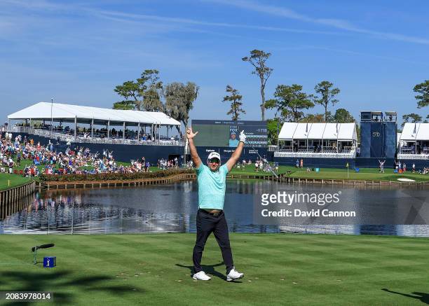 Ryan Fox of New Zealand celebrates after holing his tee shot on the 17th hole for a hole in one during the first round of THE PLAYERS Championship on...