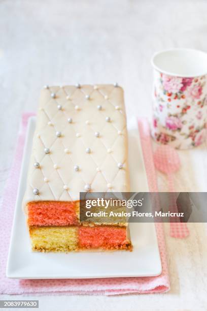 battenberg cake with marzipan and edible silver beads - battenburg stockfoto's en -beelden