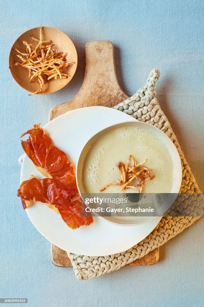 Celery and prosecco soup with serrano chips